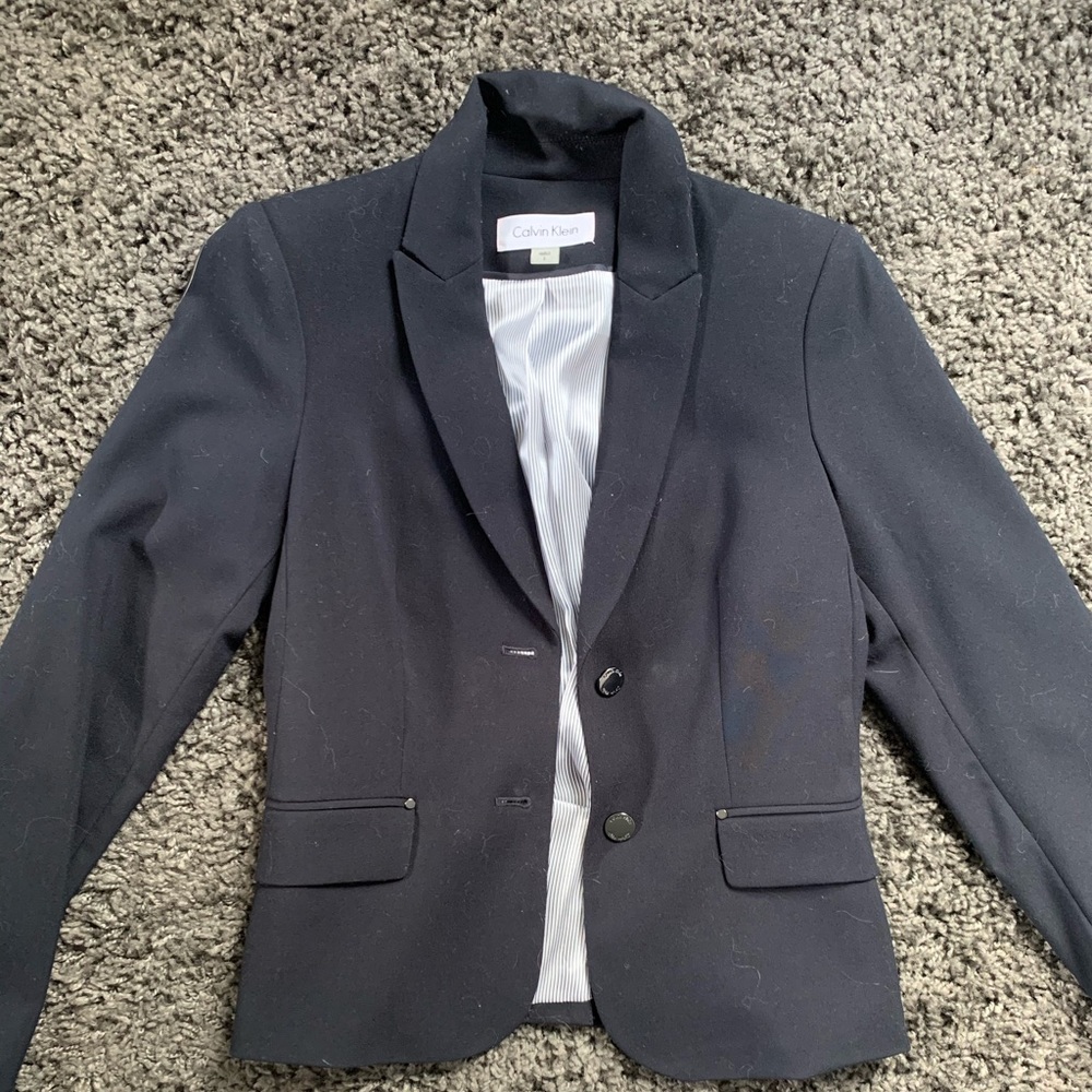 Navy blue woman’s suit jacket